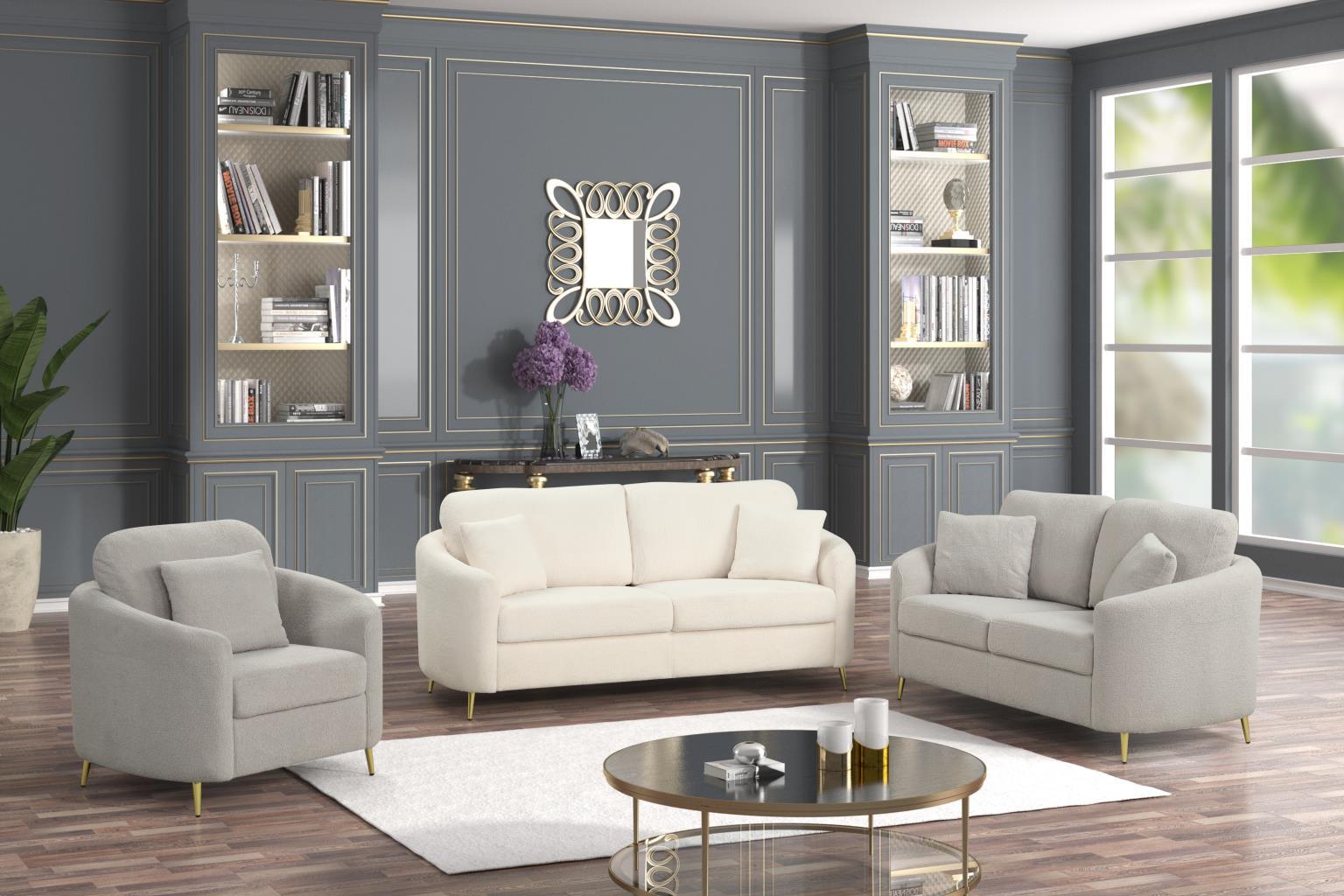 Modern living room with white sofa, armchair, and coffee table in a stylishly decorated room.