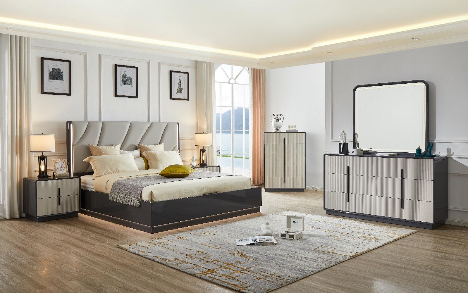 Modern bedroom with gray upholstered bed, nightstands, and dresser.