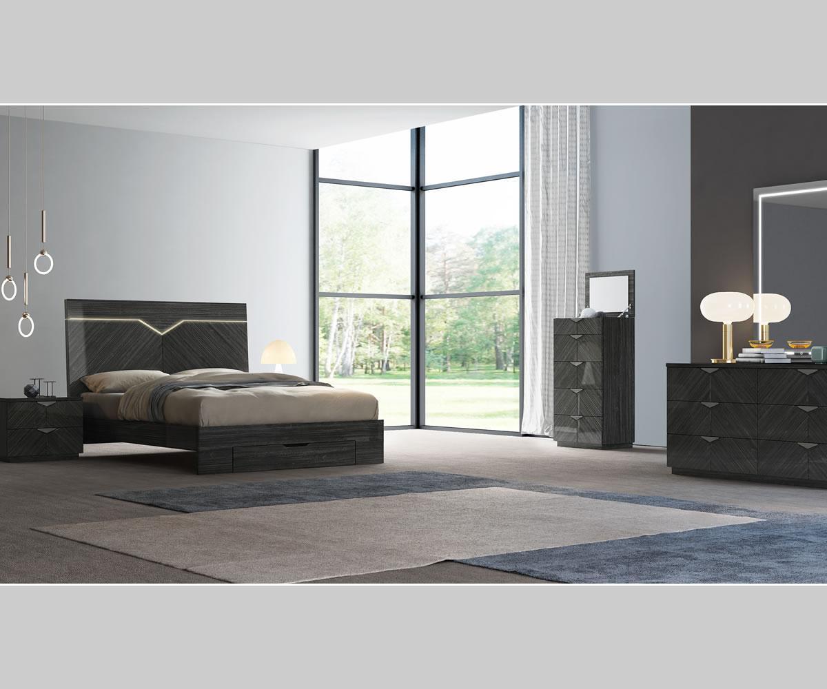 Modern bedroom with dark wood furniture including a bed, dresser, and nightstands.