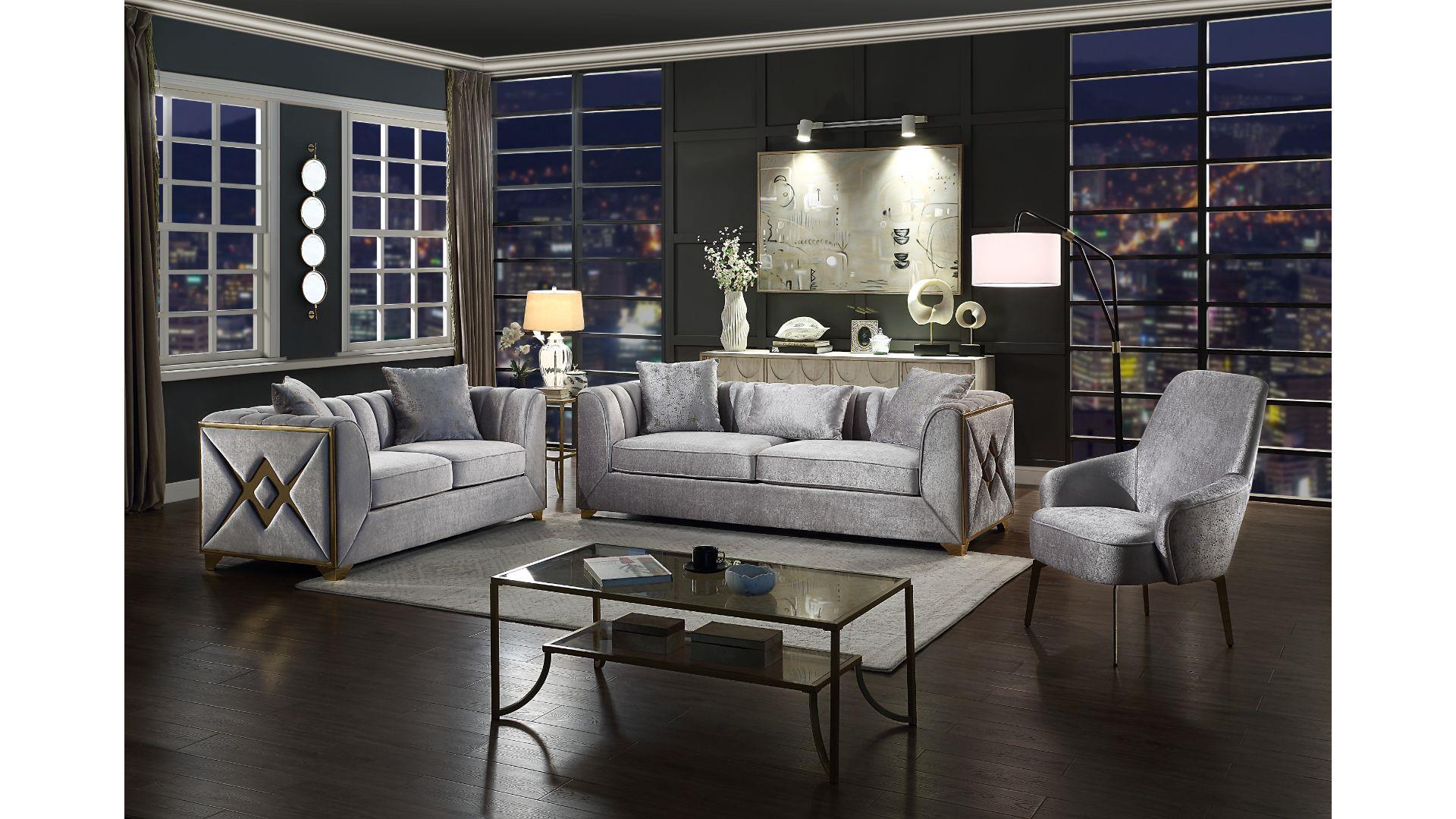 Modern living room with gray sofa, armchair, and coffee table in a stylish interior setting.