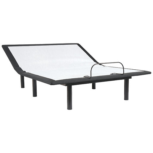 Black adjustable bed frame with glass top on a white background